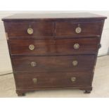 A Victorian mahogany 2 over 3 chest of drawers with brass drop down handles. Brass escutcheons to