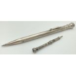 A silver filled propelling pencil by Eversharp with engine turned decoration and initials "W.J.C "