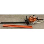 A Stihl HS45 petrol hedge cutter with 24" cutting blade and blade cover.