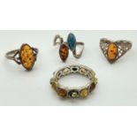 4 silver and white metal amber set dress rings. To include a heart design full eternity style ring