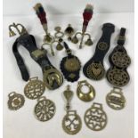 A collection of vintage brass heavy horse accessories, to include terrets, plumes, bells and