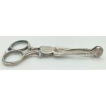 A pair of antique silver sugar scissors/tongs with shell shaped grips. Hallmarked to grips with lion