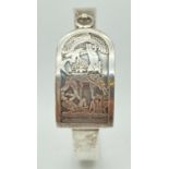 An Egyptian silver bangle with decorative panel depicting ancient Egyptian figures. With hook and