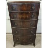 An early Victorian mahogany bow fronted 6 drawer tallboy. With original brass drop handles and