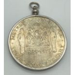 A Metropolitan Police 150th Anniversary coin/medallion in a white metal mount with necklace