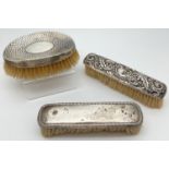 3 Victorian & Edwardian silver backed dressing table brushes. An oval shaped curved back brush