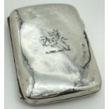 A Victorian silver curve backed cigarette case with engraved emblem to front. Hallmarked to both