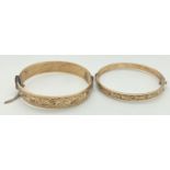 2 vintage 9ct gold metal core bangles with floral engraved decoration. One with safety chain and