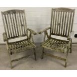2 reclining garden wooden chairs with slatted backs and seats.