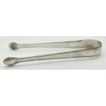 A pair of Georgian silver sugar tongs with feather edged detail. Stamped to inner spoon bowls with