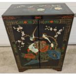 A vintage Chinese black lacquer 2 door cupboard with hand painted floral & bird detail. With