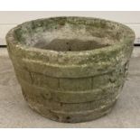 A vintage concrete garden planter in the form of a wooden barrel. Approx. 26cm tall x 44cm diameter.