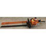 A Stihl HS45 petrol hedge cutter with 24" cutting blade and blade cover.
