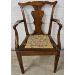 A Georgian walnut carver armchair with square legs, shaped back & back panel and needlepoint