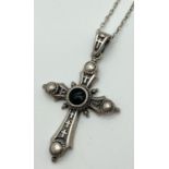 A decorative cross pendant on a 24 inch belcher chain with spring clasp. Cross pendant set with