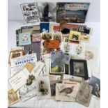 A box of assorted vintage ephemera to include: photographs, postcards, leaflets, tourist guides