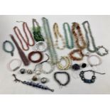 A quantity of assorted vintage and modern costume jewellery, mostly semi precious stones. To include