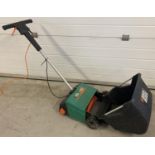 An electric 3 in 1 Black and Decker garden GD200 Lawnraker 30cm. Not tried & tested.