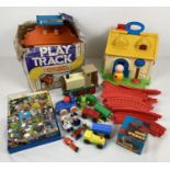 A collection of vintage toys to include a Fisher Price activity cottage (incomplete), a Matchbox