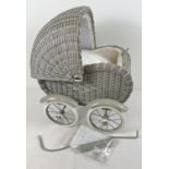 A new basket design, painted grey dolls pram, complete with instructions. Partly assembled. 1