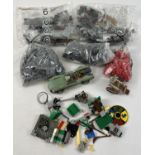 A collection of assorted Lego pieces to include sealed bags and bagged Harry Potter playset.