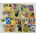 154 assorted modern Pokemon trading cards to include 4 holo cards.