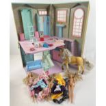 A Barbie folding townhouse together with a Barbie Horse, dolls, furniture, clothes & accessories.