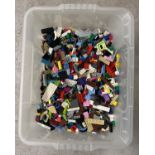 A tub containing 5kg of assorted Lego pieces.