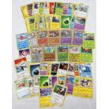 A collection of 107 assorted Pokemon trading cards to include holo's & reverse holo's.