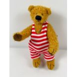 An 8" Limited Edition fully jointed mohair Grisly German teddy bear named Marco. With red striped