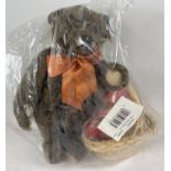 A 13" Steiff dark brown mohair, fully jointed 'Autumn 1997' teddy bear with growler. Wearing