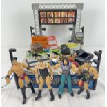 A WWF part Wrestle Mania arena together with 4 action figures and accessories.