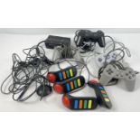 A collection of vintage games console controllers. Comprising: 2 x Playstation 1 grey wired