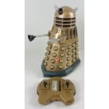 A 13" remote control BBC Doctor Who, 2004 Dalek, in gold colourway. Battery operated with sounds and