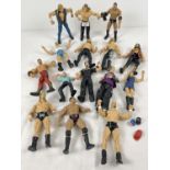 A collection of 15 WWE/WWF action figures to include Cactus Jack, Stephanie McMahon and The Rock.