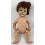 A vintage 17.5" German doll with bisque head and composite body and limbs. Marked to back of neck '