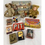 A box of assorted vintage toys and games to include rubiks cube, playing cards, boxed games, soft