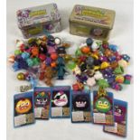 2 Limited Edition Collectors tins of assorted Moshi Monster play figures. Together with a small