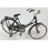 A vintage 11" model of a Bicycle, made in Indonesia. With rubber wheels and plastic handle grips,