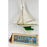 A vintage boxed Star Productions green and white SY5 Northern Star pond yacht. Approx. 62cm tall.