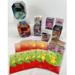 A collection of Pokemon card empty packets, tins, boxes and envelopes. To include: 10 x Macdonalds