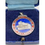 A silver and enamel fob medallion for the National Union Of Railwaymen. Complete with vintage box.