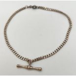 A 9" silver curb chain bracelet with a T bar pendant and spring ring clasp. Stamped 925 on joining