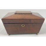 A vintage mahogany sarcophagus caddy with brass feet and escutcheon. Interior lined with green baize