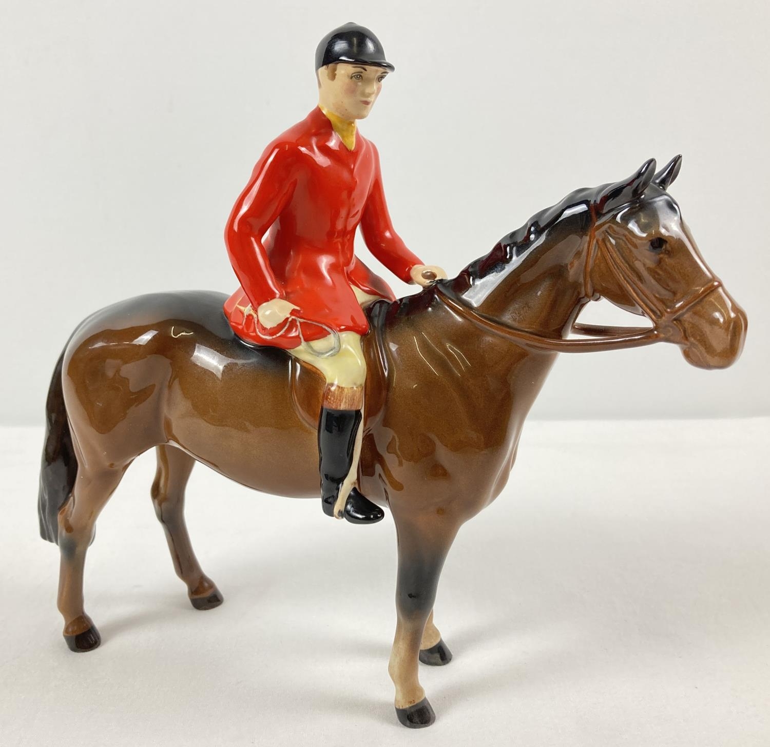 A Beswick ceramic Huntsman and horse figurine #1501, in brown gloss. Issued from 1957 - 95 and