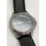 A men's wristwatch by Kickers with black leather strap. Stainless steel case with grey face,