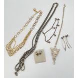 A collection of silver and white metal jewellery items. To include white metal & clear stone set