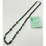 A 27" Nephrite green jade necklace made from round and marquise shaped beads. With gold tone pierced