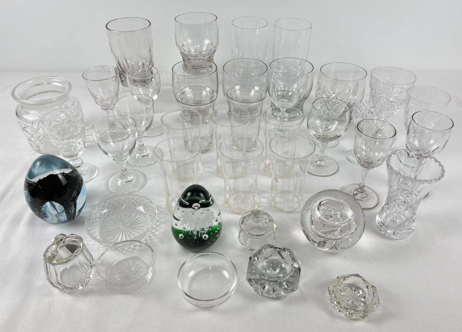 A collection of vintage and modern glassware. To include part sets of glasses, paperweights and