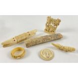 A collection of antique and vintage bone and ivory carved items. To include napkin ring, peacock